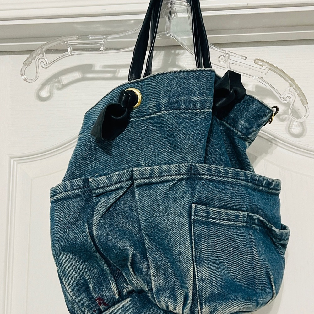 Clare V Marine Washed Denim Light Tote Bag with Slouchy Shape and Black Handles.
